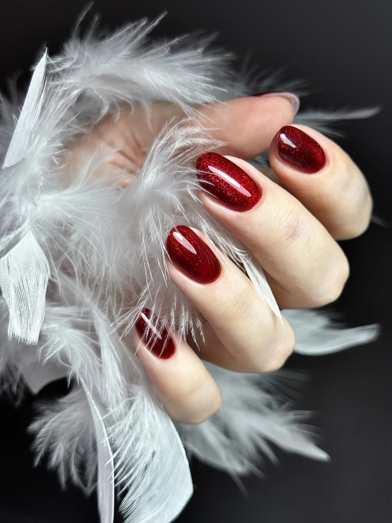 Deep red glitter gel manicure by Ruta Beauty