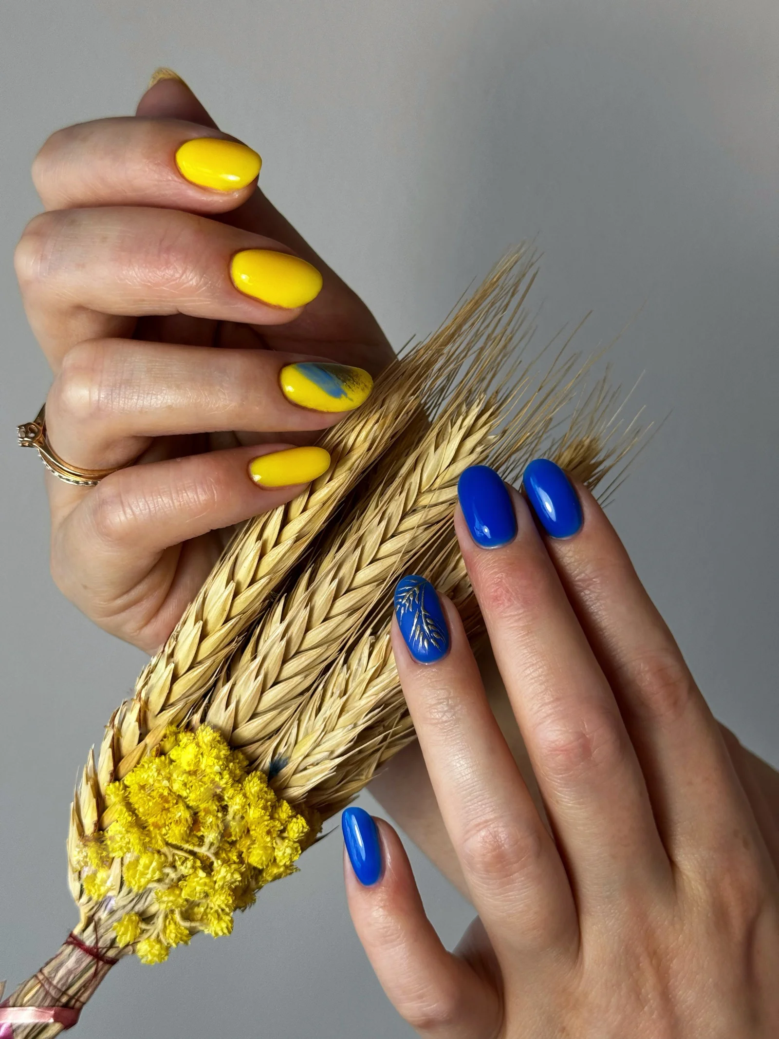 Yellow and blue Ukrainian nail design by Ruta Beauty